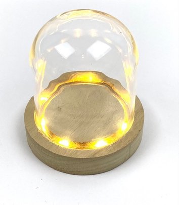 Cloche en verre sur support bois lumineuse.